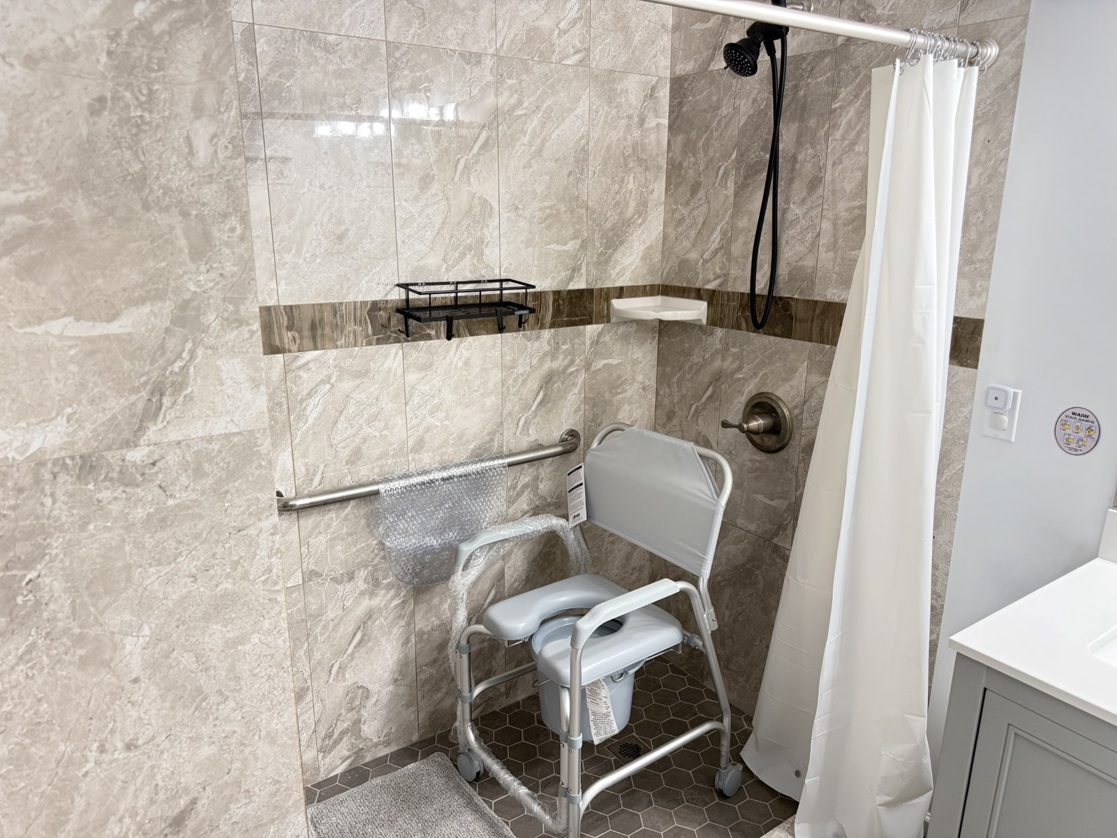 Shower with a shower chair and grab bars