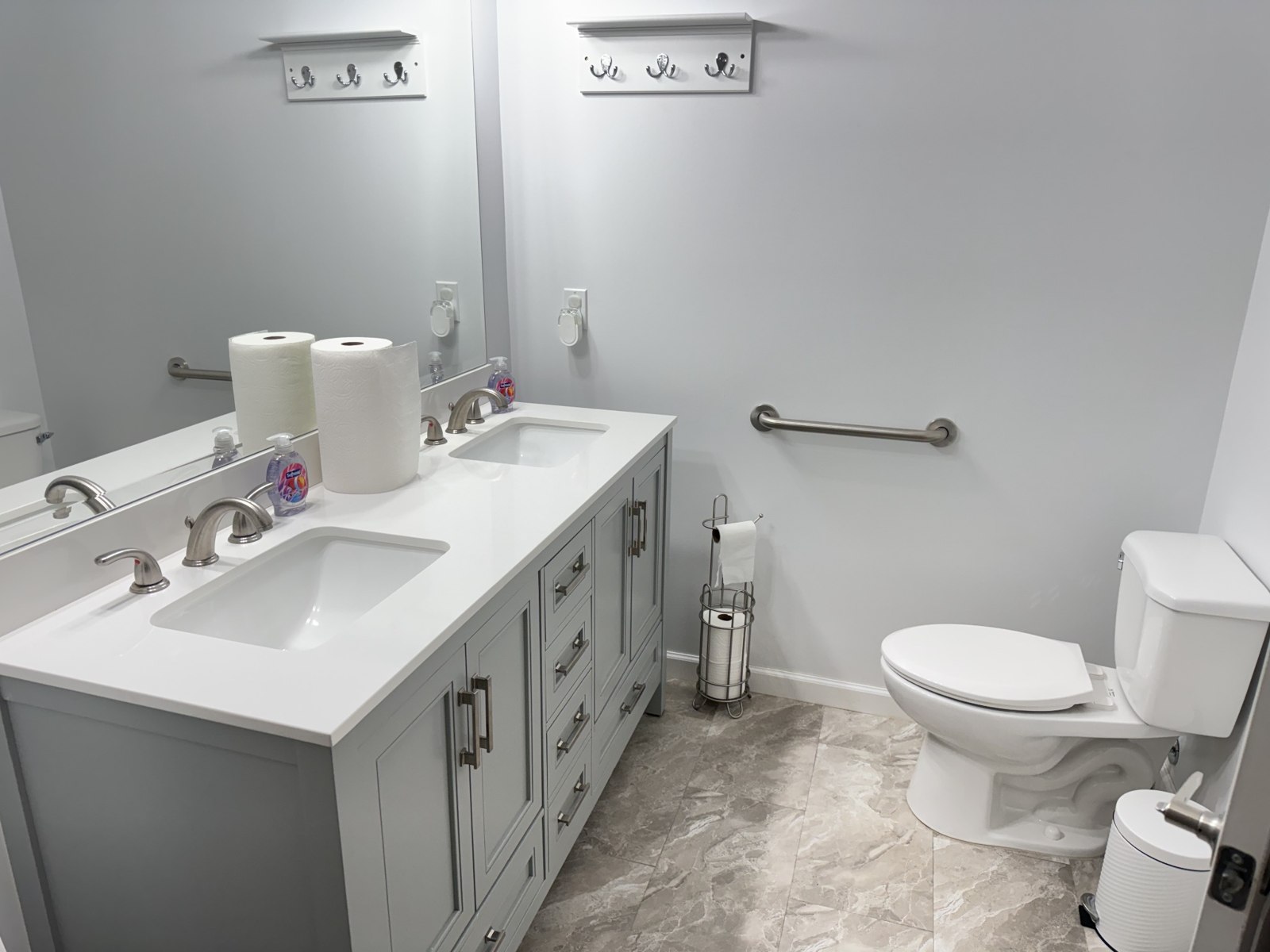 Bathroom with vanity, toilet, and grab bar