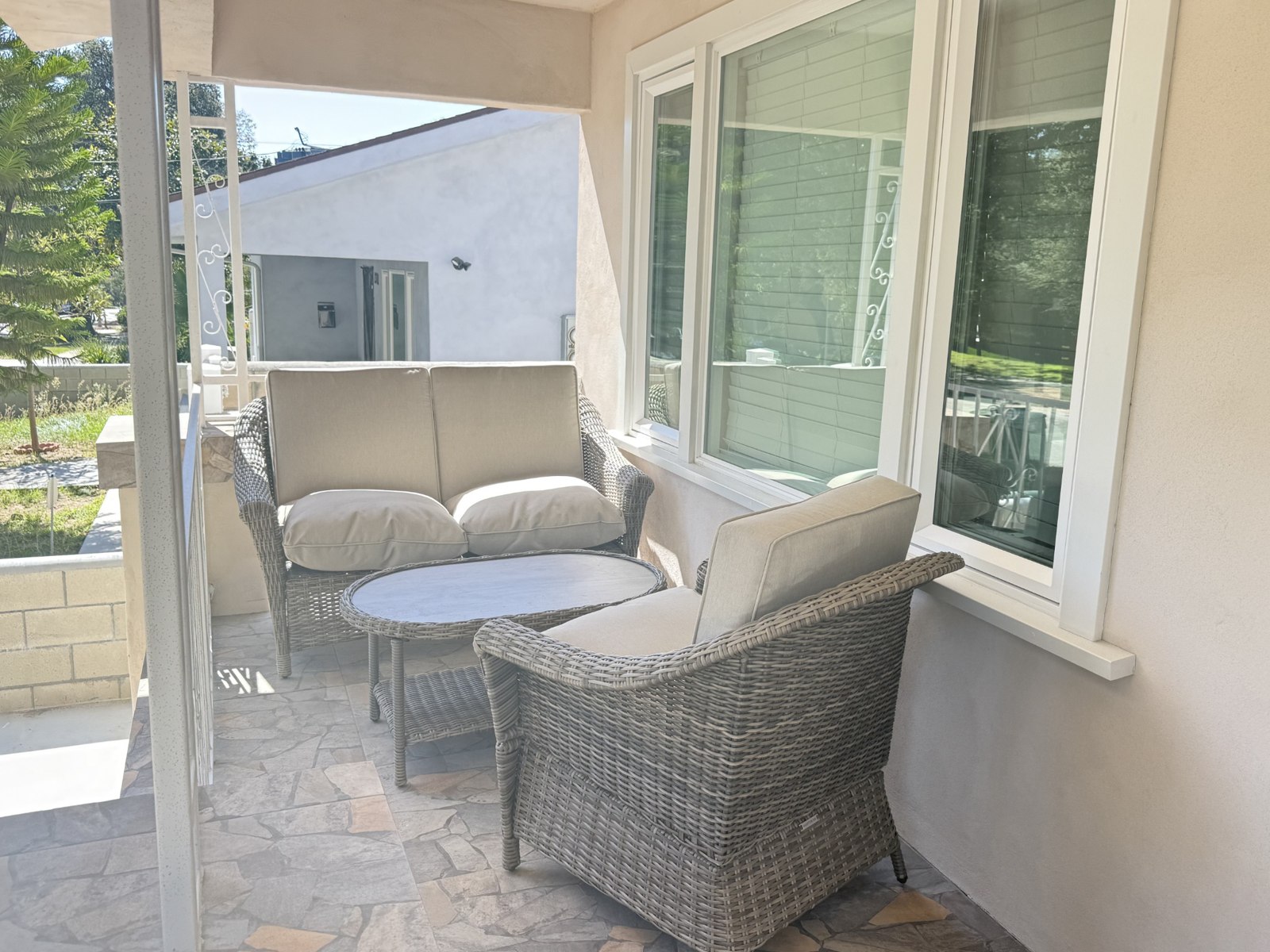 Covered outdoor seating with cushioned chairs
