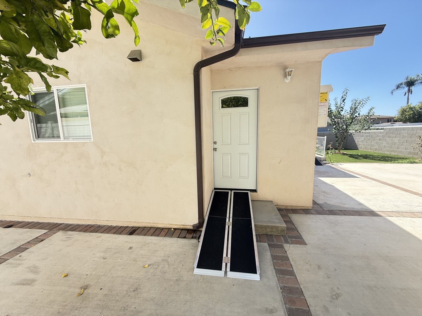 Exterior entrance with a portable ramp