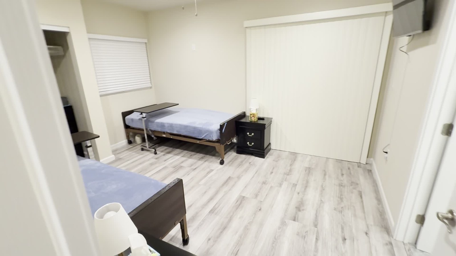 Resident room with beds and bedside furniture